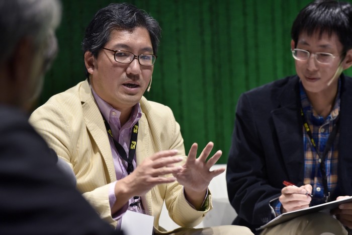 Yuji Naka speaking to journalists in 2016